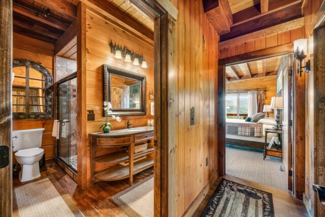 log home master bedroom suite showing bath and dressing area